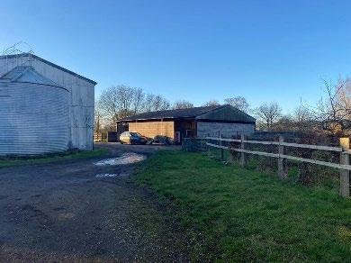 Agricultural buildings and yard at Bridge Farm